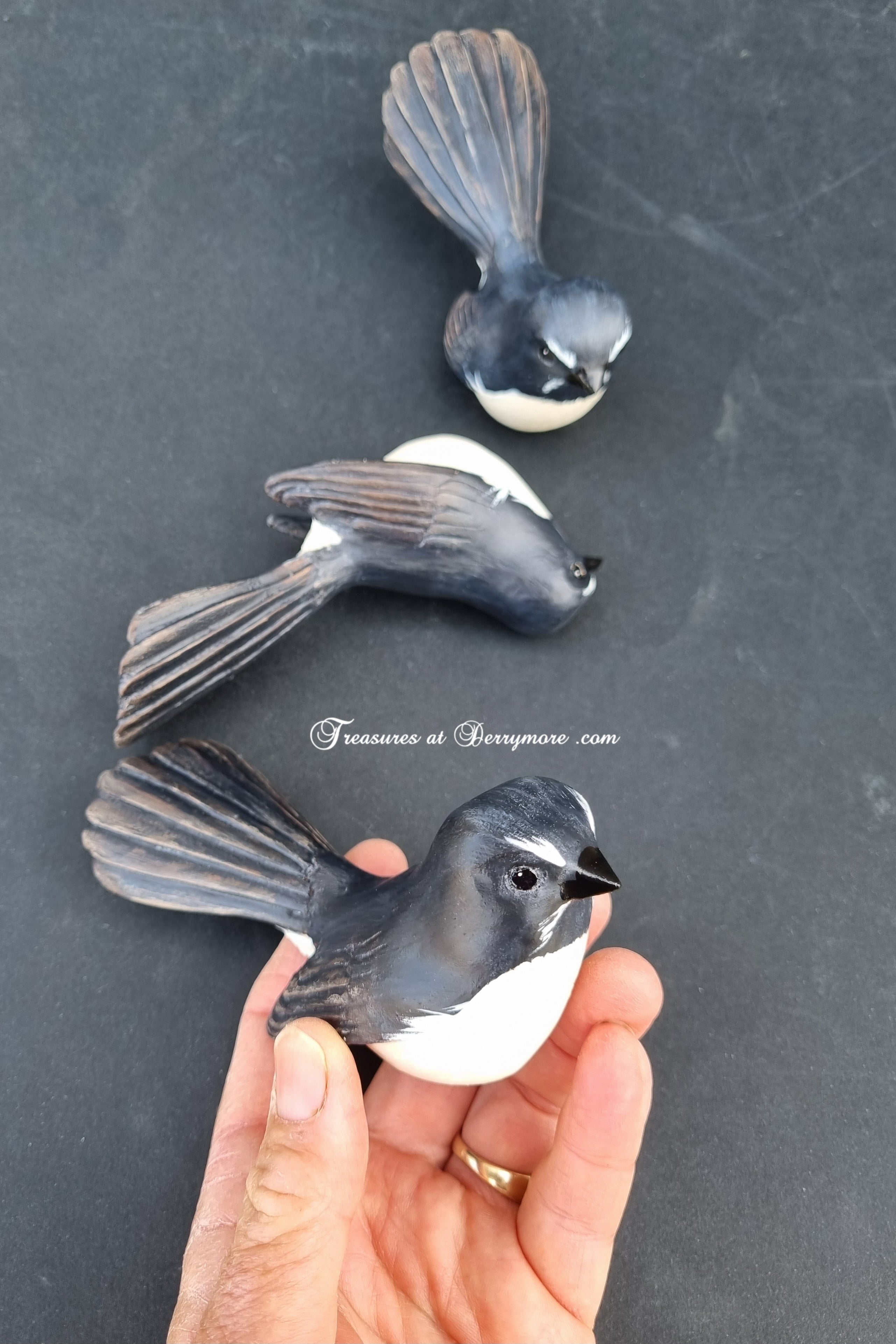 Hand carved Williewagtail sculpture in hand. Black & white Australian bird. Detailed feather carving on wings & tail. 