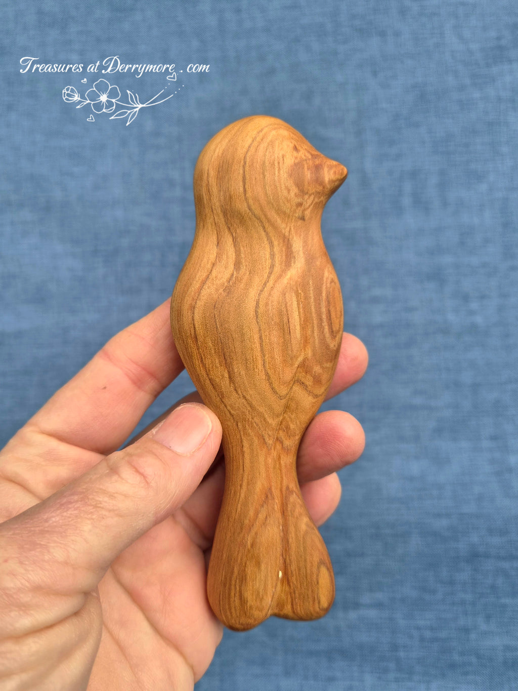 Hand carved wooden comfort piece shaped like a bird. Held in the hand