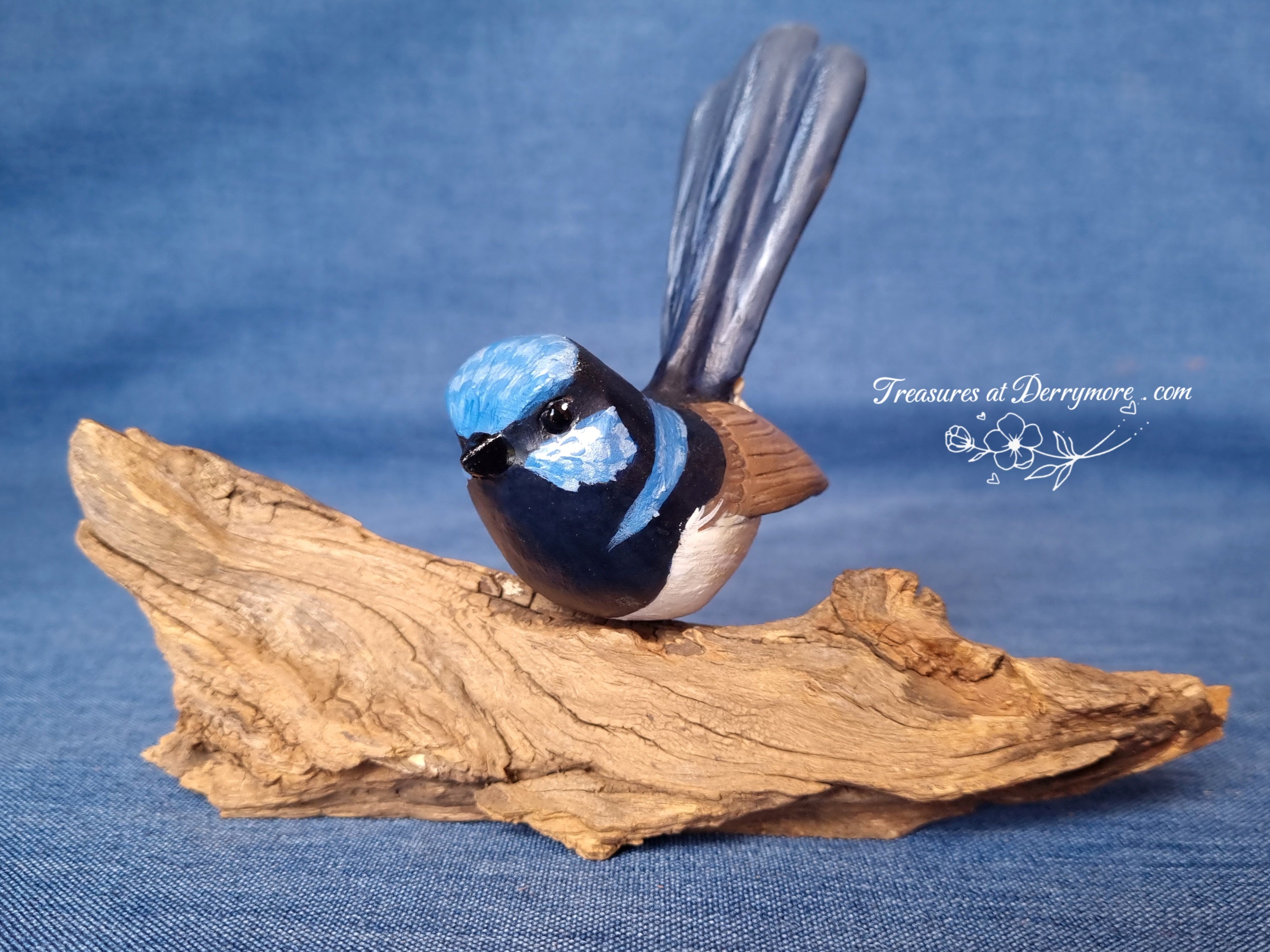 Hand carved Australian bird,Superb Fairy wren. Mounted on natural branch