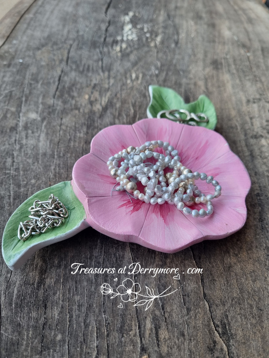Hand carved trinket dish, painted pink flower shaped dish with green carved leaves with jewellery 