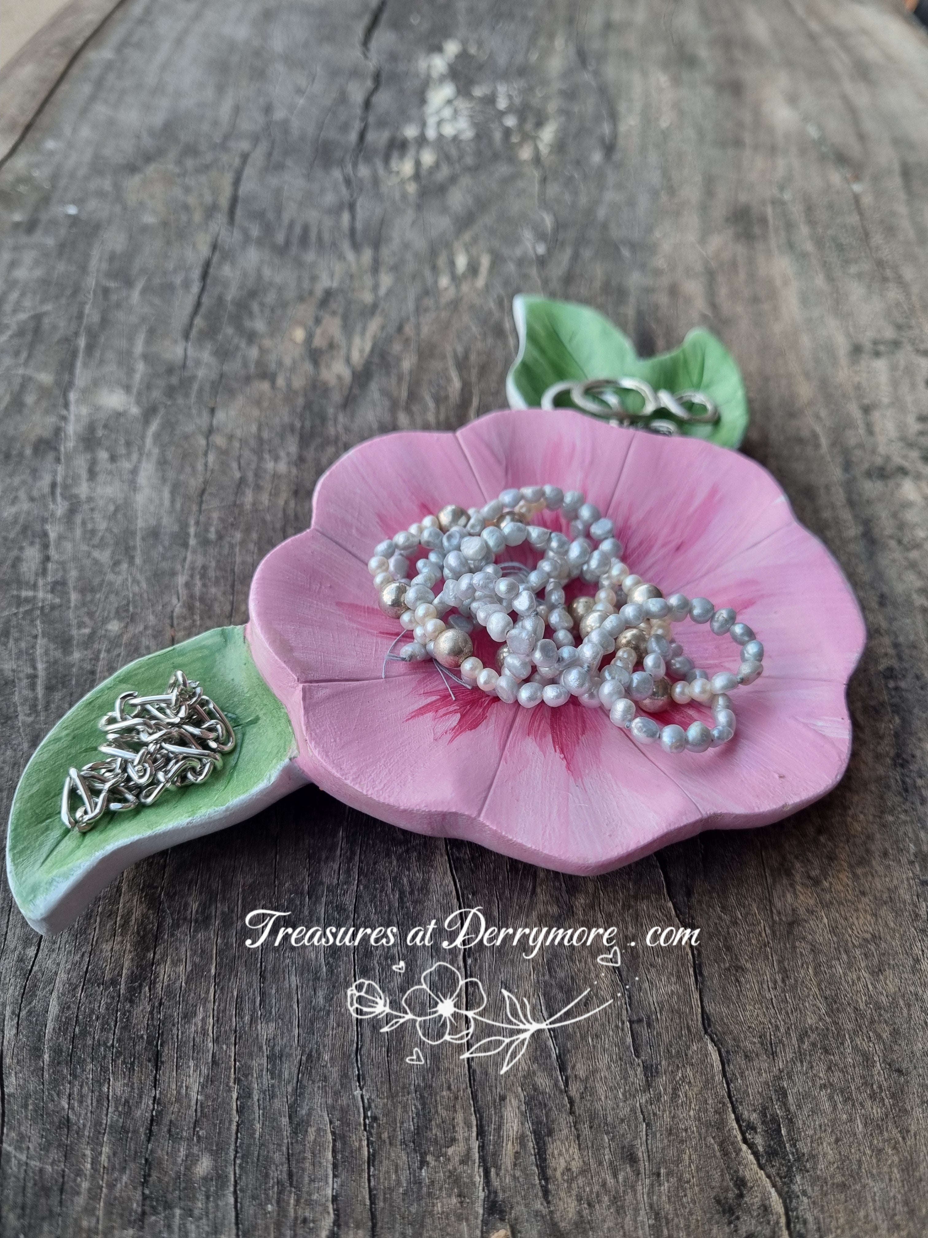Hand carved trinket dish, painted pink flower shaped dish with green carved leaves with jewellery 