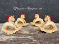 Hand carved wooden Christmas decorations. Rocking horses cut from pine decorated with white string tail, red ribbon hanger.