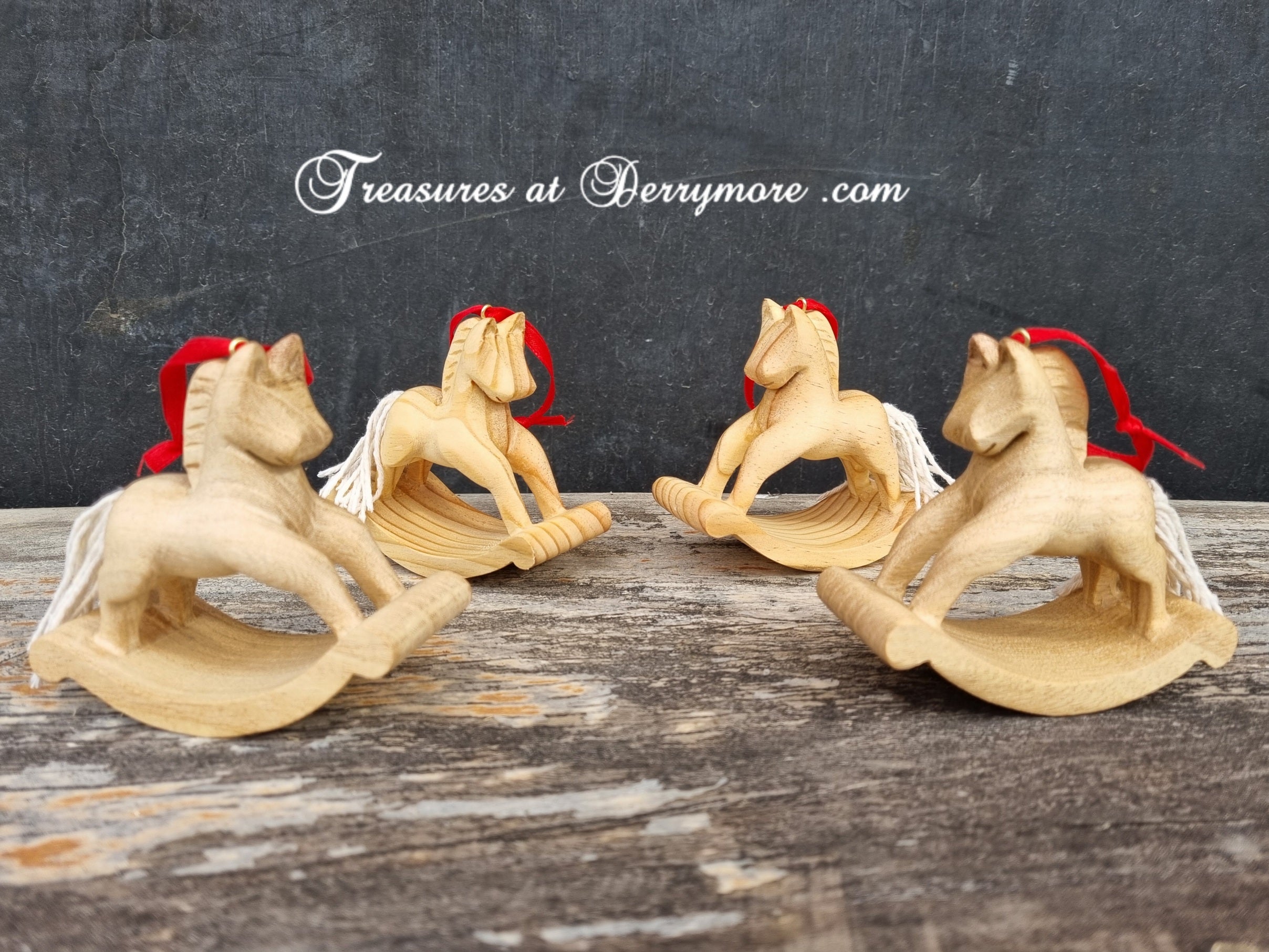 Hand carved wooden Christmas decorations. Rocking horses cut from pine decorated with white string tail, red ribbon hanger.