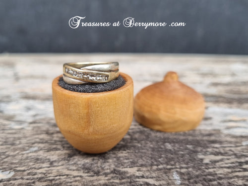 Hand carved wooden acorn ring box with ring