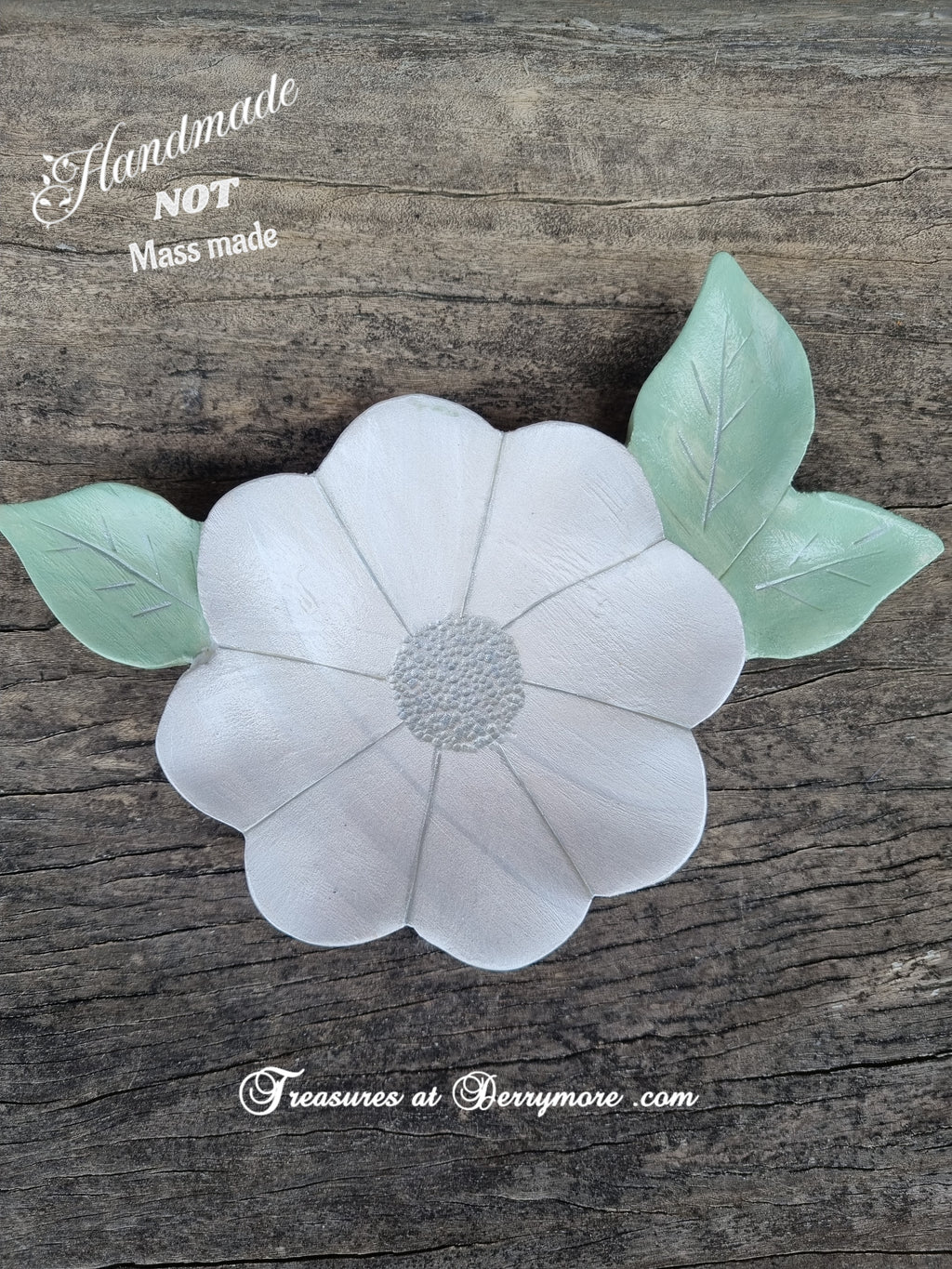 Hand carved and painted white flower shaped dish with green carved leaves