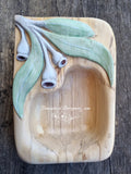 Hand carved wooden dish with relief carved & painted Eucalyptus leaves at one end with white gumnuts. Wooden dish left natural colour of spalted birch timber